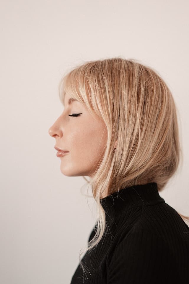Blonde woman photographed profile portrait