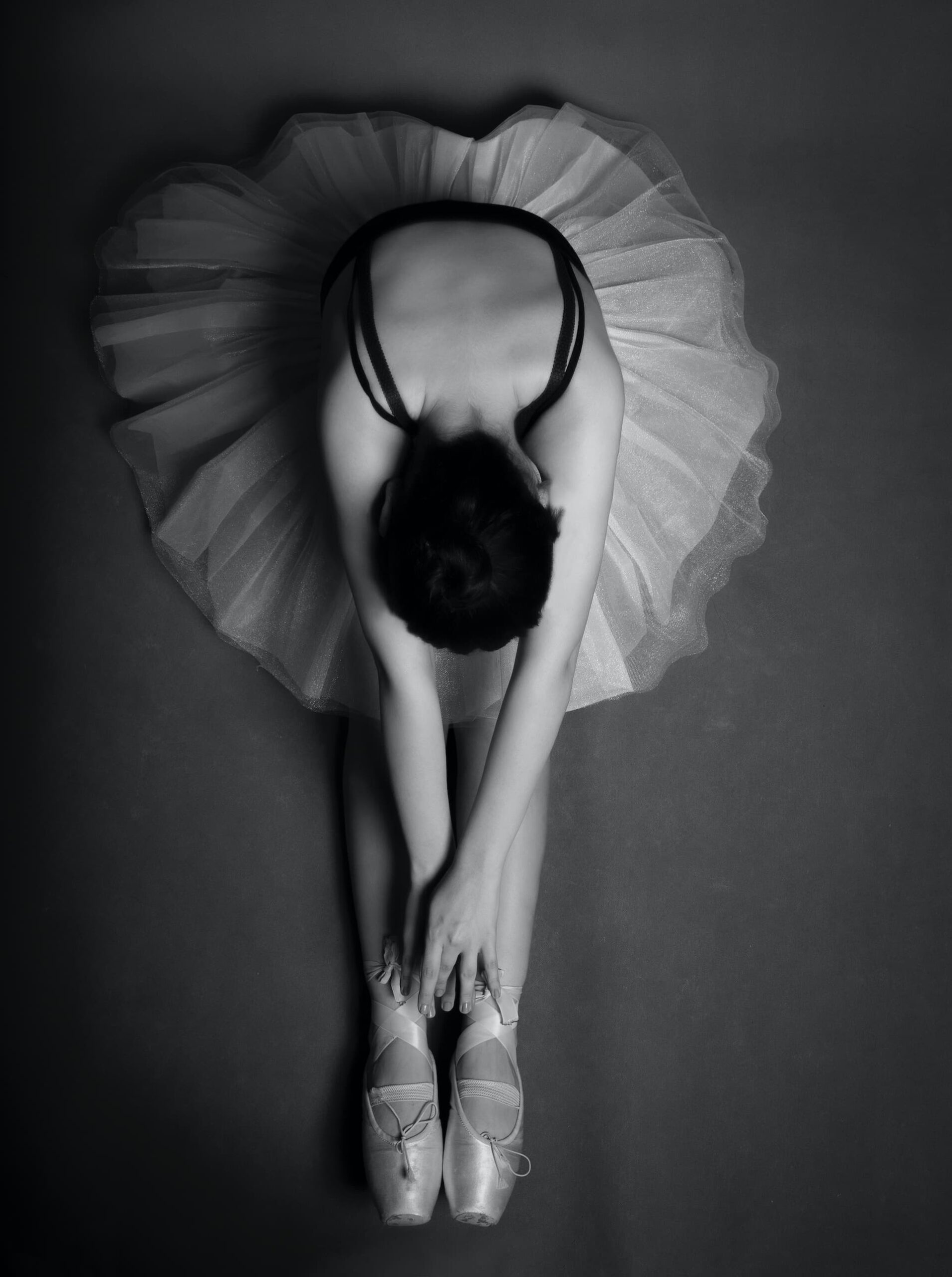 Shayan Rostami, black and white photograph of a graceful ballerina shot from above